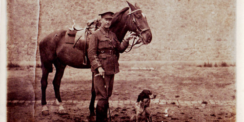 John McCrae, writer of “In Flanders Fields,” stands beside his horse, Bonfire, and his dog, Bonneau. The dog would often accompany McCrae, as he tended to wounded soldiers.