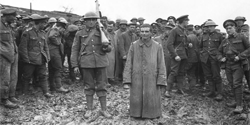 German prisoner captured by 78th Battalion during night raid. May, 1918. Photo: Dept. of National Defence / LAC, MIKAN no. 3403156.