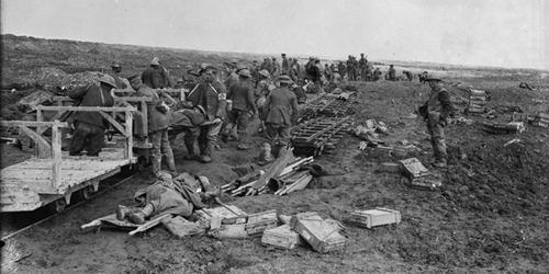 German prisoners and Canadian Red Cross men assist in the despatching of wounded on a light railway. Vimy Ridge. April, 1917. Dept. of National Defence  /LAC, MIKAN no. 3194781.